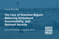 white text on blue background, image of detention camp in northeast syria